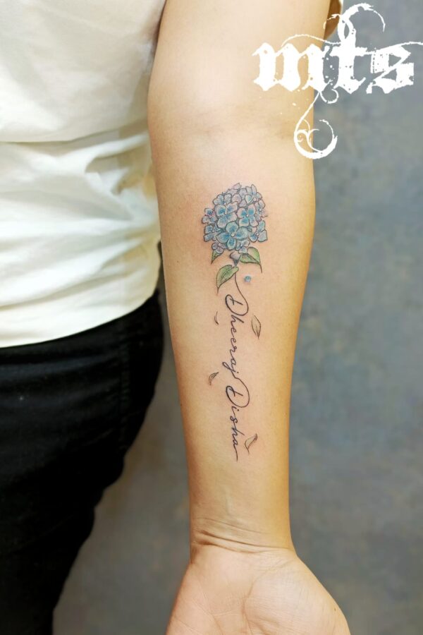 Customised Name with Feather & lotus Tattoo inked by @max____soni  @tattoo_factory_jaipur #nametattoo #tattooforgirls #tattooidea… | Instagram